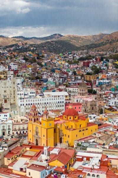 The beautiful Mexican Guanajuato city with colorful buildings surrounded by mountains The beautiful Mexican Guanajuato city with colorful buildings surrounded by mountains